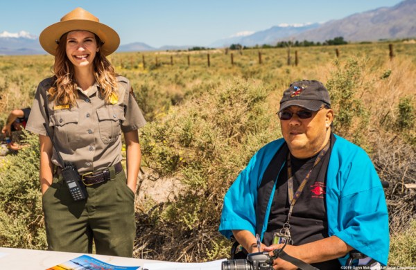 Manzanar Committee member James (Jim) To (right), shown here with former Manzanat National Historic Site staff member Katie Busch, during the 50th Annual Manzanar Pilgrimage, April 27, 2019, at the Manzanar National Historic Site. Photo by Gann Matsuda/Manzanar Committee.